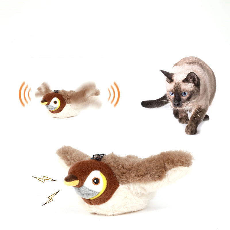 Electric plush toy resembling a bird with a cat looking at it on a white background